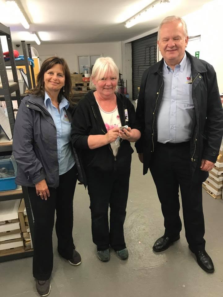 The directors of Wilson's Flooring Specialists at hedgehog sanctuary